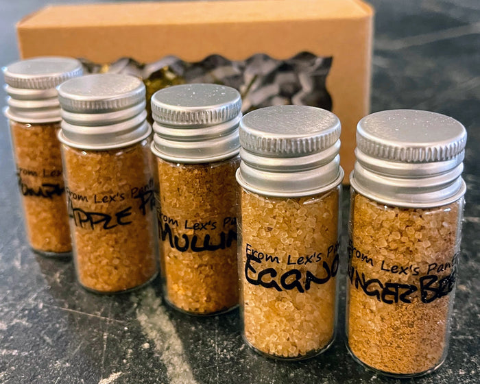 5 sample bottles filled with spiced sugar with labels with from Lex's Pantry 