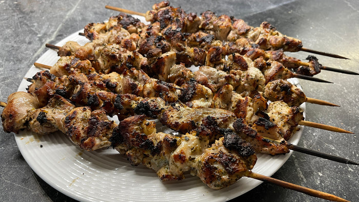 Danforth Greek Souvlaki Chicken on skewers on a white plate